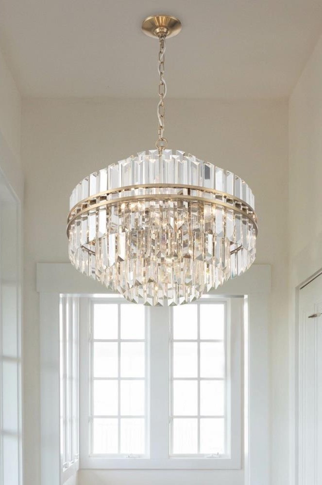  One Tiered Crystal Chandelier with Aged Brass Frame Hanging in Entryway