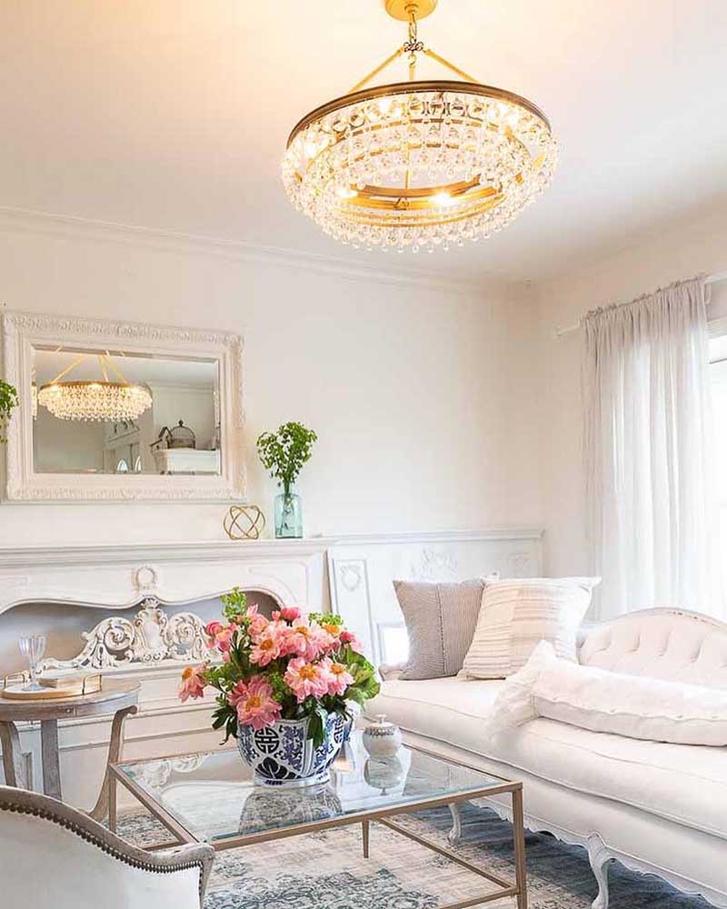 one teardrop crystal chandelier hanging in living room