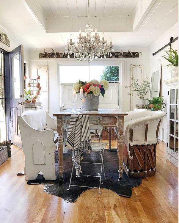 crystal chandelier hanging over dining room table