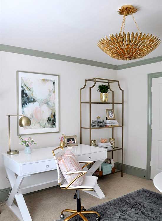 gold chandelier hung in home office