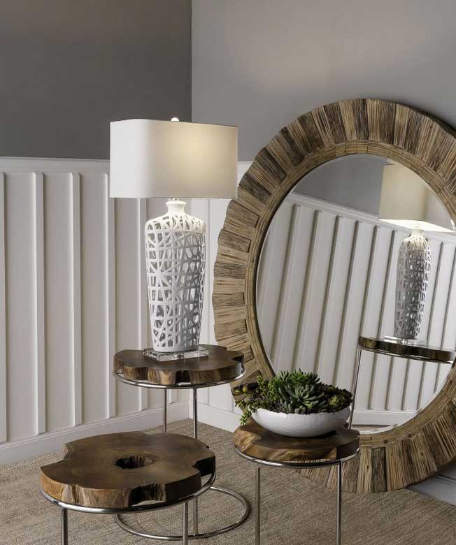 table lamp on a wooden side table in the corner of the room