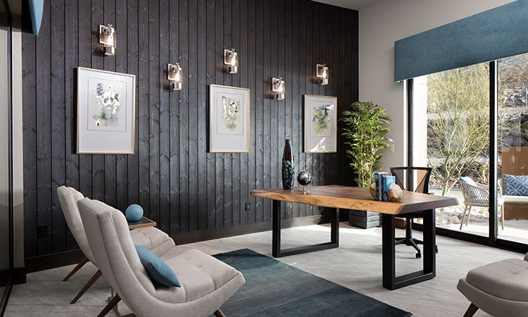  5 wall sconces on the wall of a home office