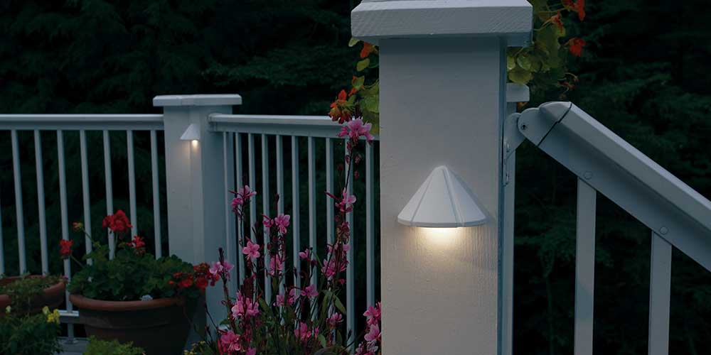 2 cone shaped deck lights attached to deck posts