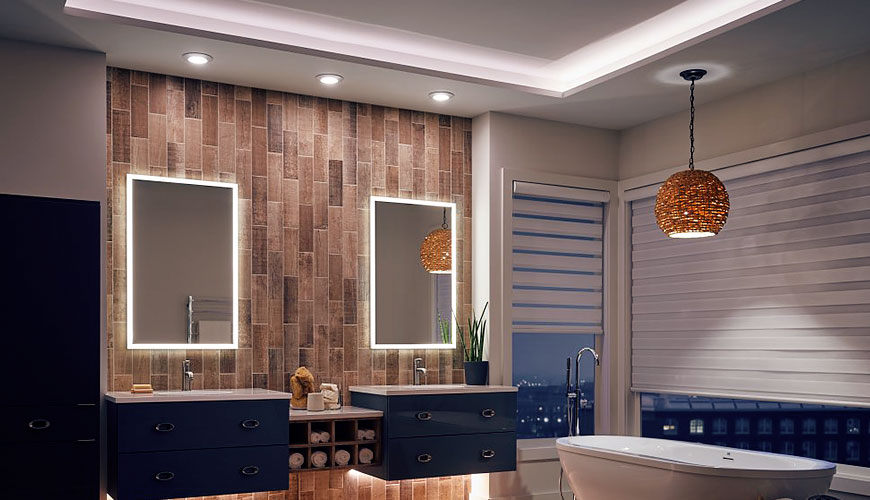 three recessed lights over two bathroom vanities and pendant light over bathtub