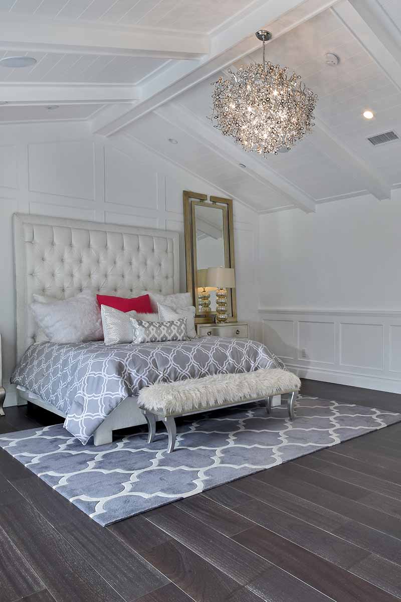 ten light crystal chandelier hanging in bedroom