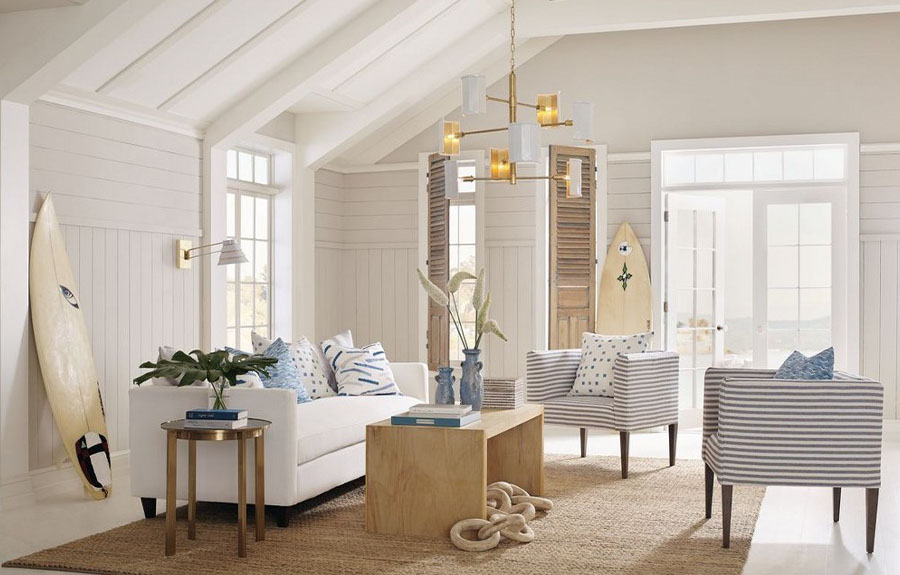 modern coastal chandelier hanging in center of living room