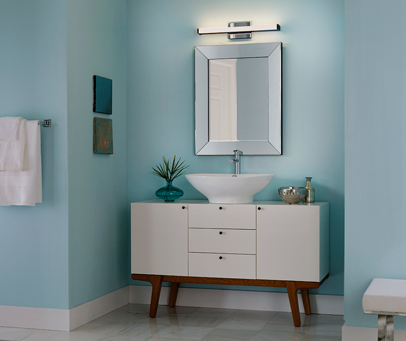 one led bath vanity light hung over mirror and bath vanity