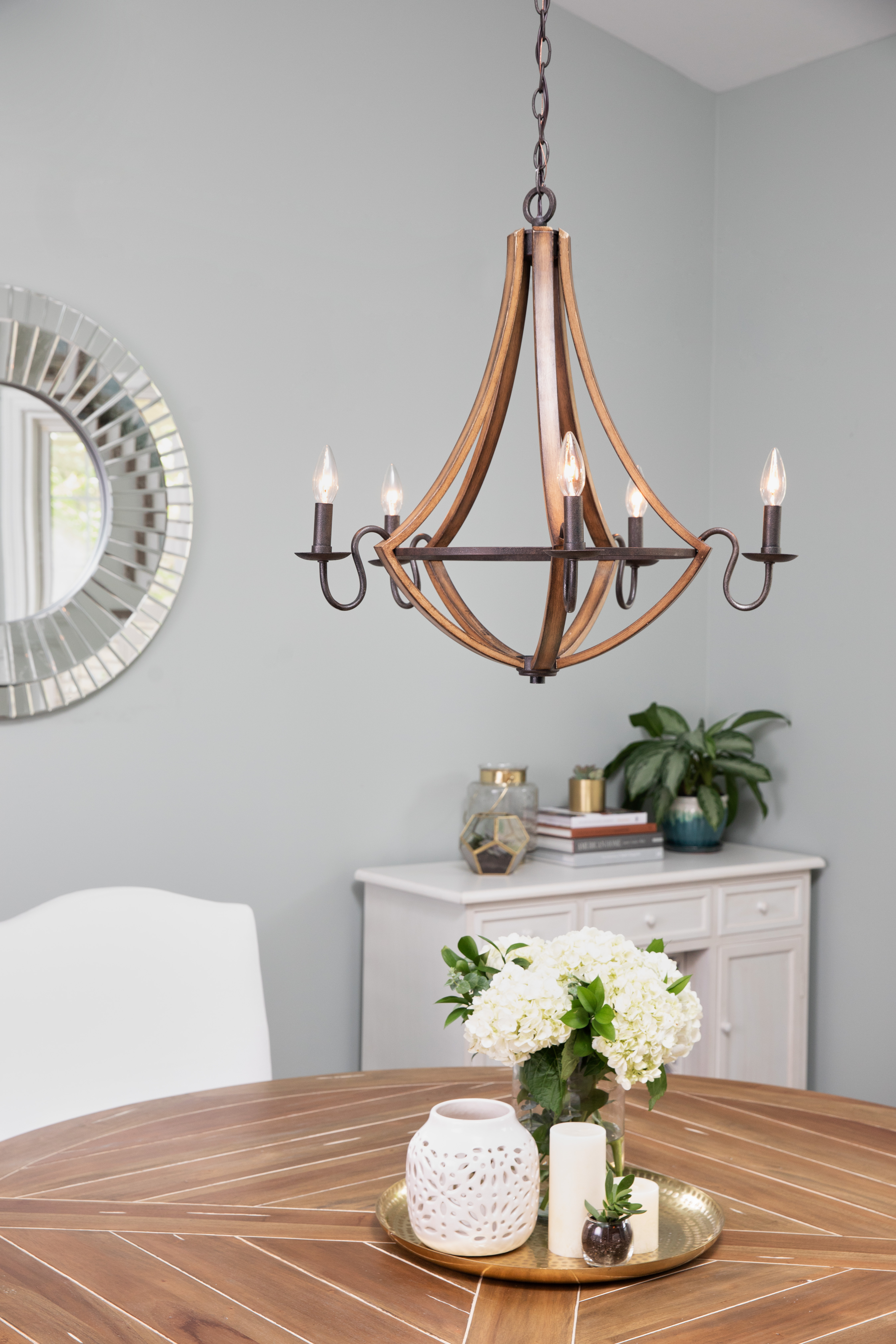 5 light farmhouse style chandelier over wooden table