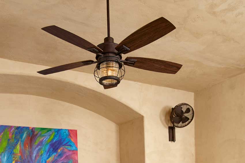 one farmhouse outdoor ceiling fan hung over dining table