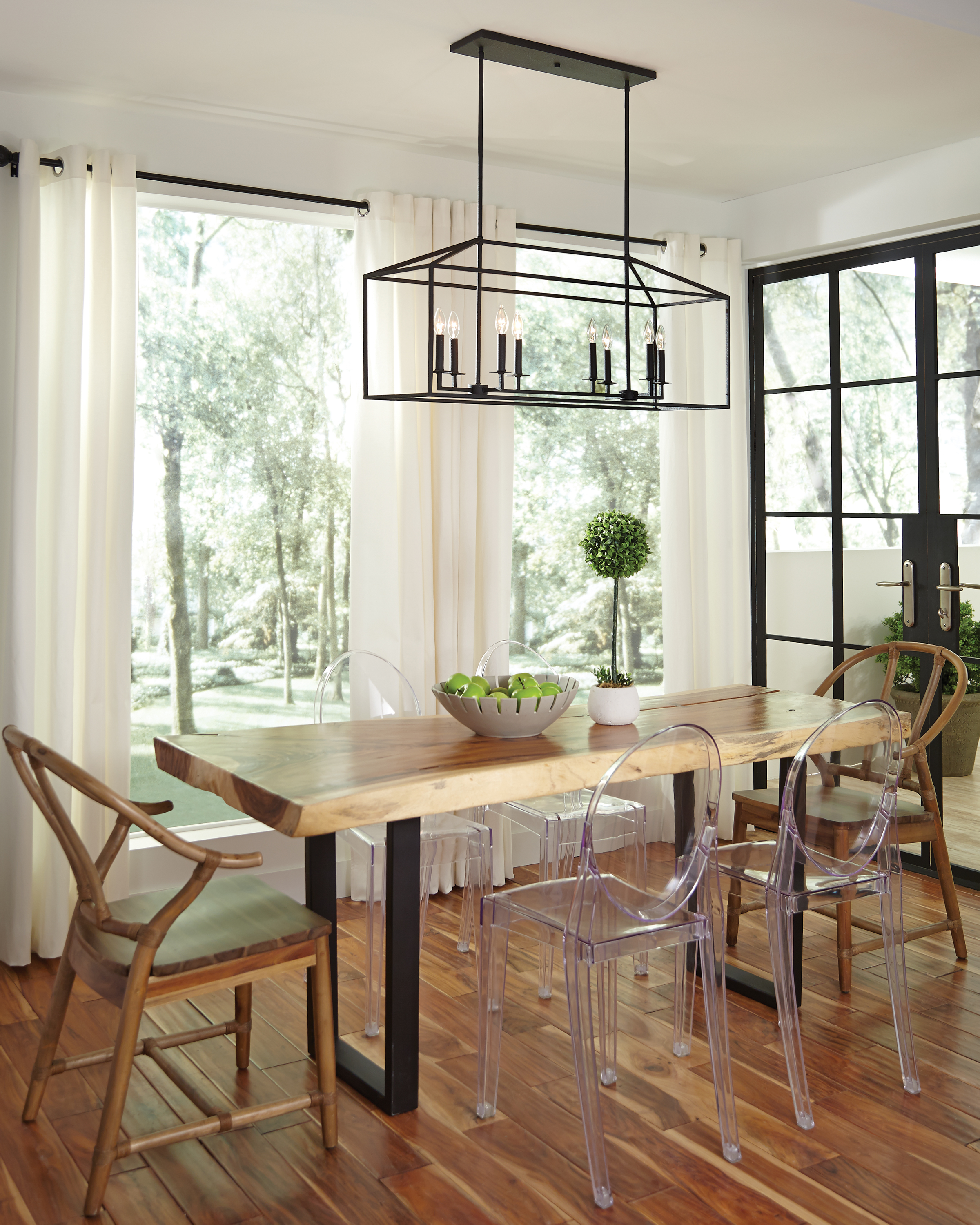 black steel 8-light island chandelier over wooden table