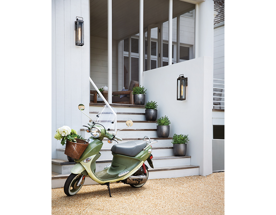 Outdoor steps to screened porch, with pebble stone floor, motorized green Buddy scooter, White home with white steps boasting natural wood risers leading to a screened porch, on the walls are two Hinkley Lighting Sag Harbor 2845BK-LL outdoor wall lanterns