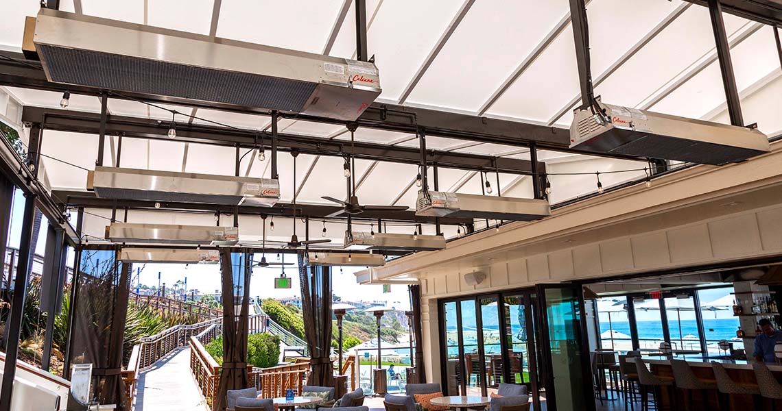 Eight Gas Patio Heaters Hanging from the Ceiling of an Outdoor Patio at a Restaurant
