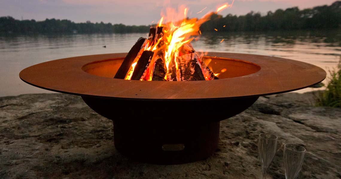 One Fire Pit at the Edge of a Lake at Sunset