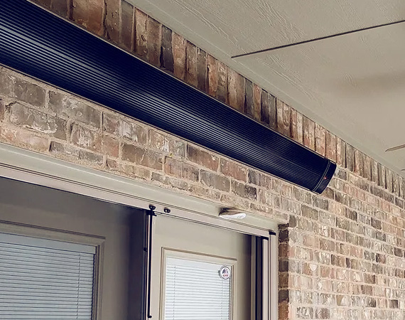 an entirely black, zero light wifi controlled heater mounted on a wall