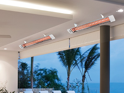 innova heater warming an outdoor patio next to the ocean at dusk